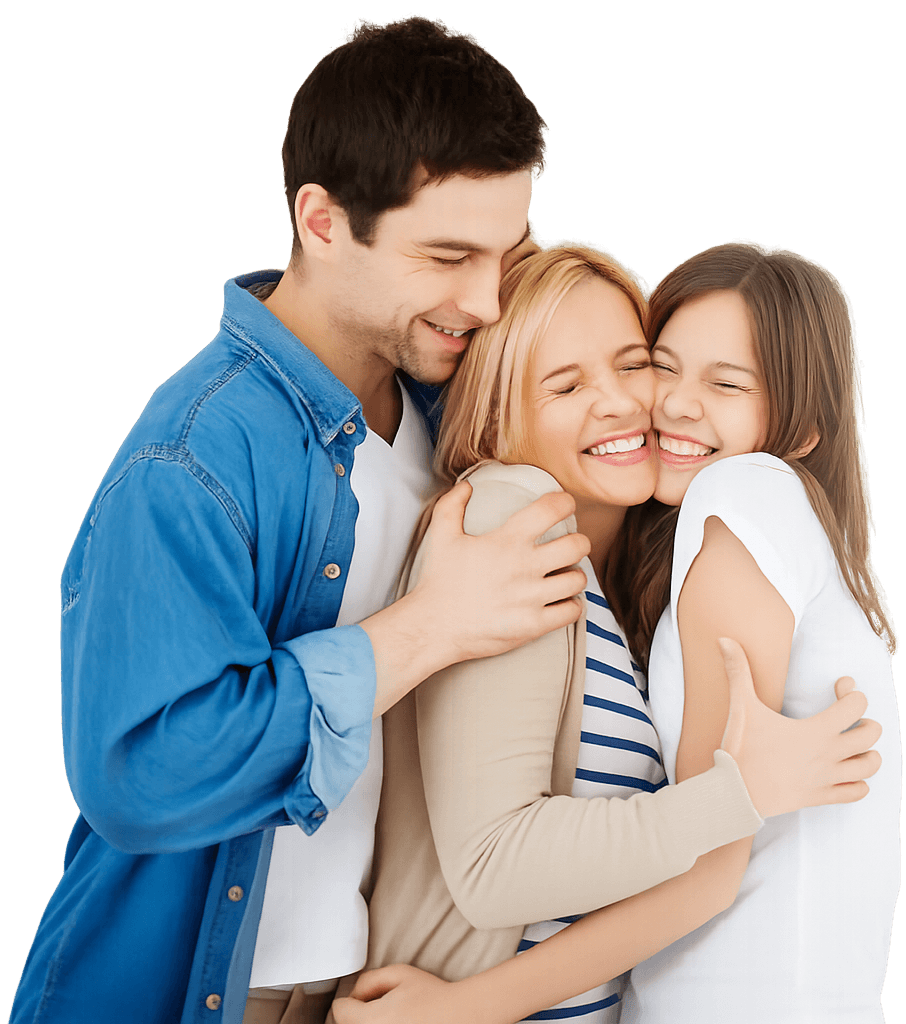 A smiling family hugging closely together
