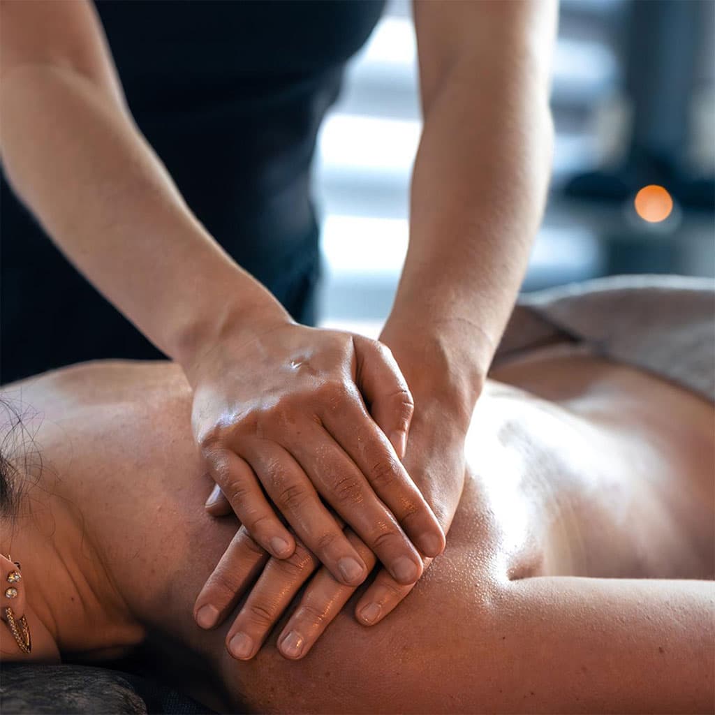 Therapist performing a therapeutic back massage